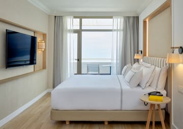 a room with a television and a bed