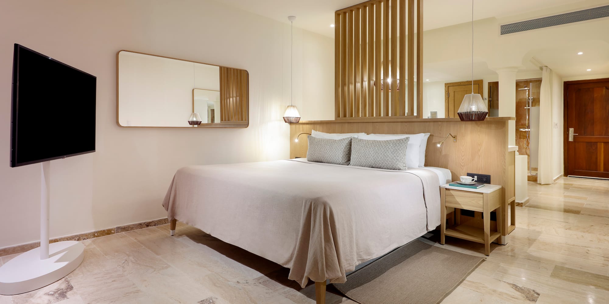 a bed with a mirror above it