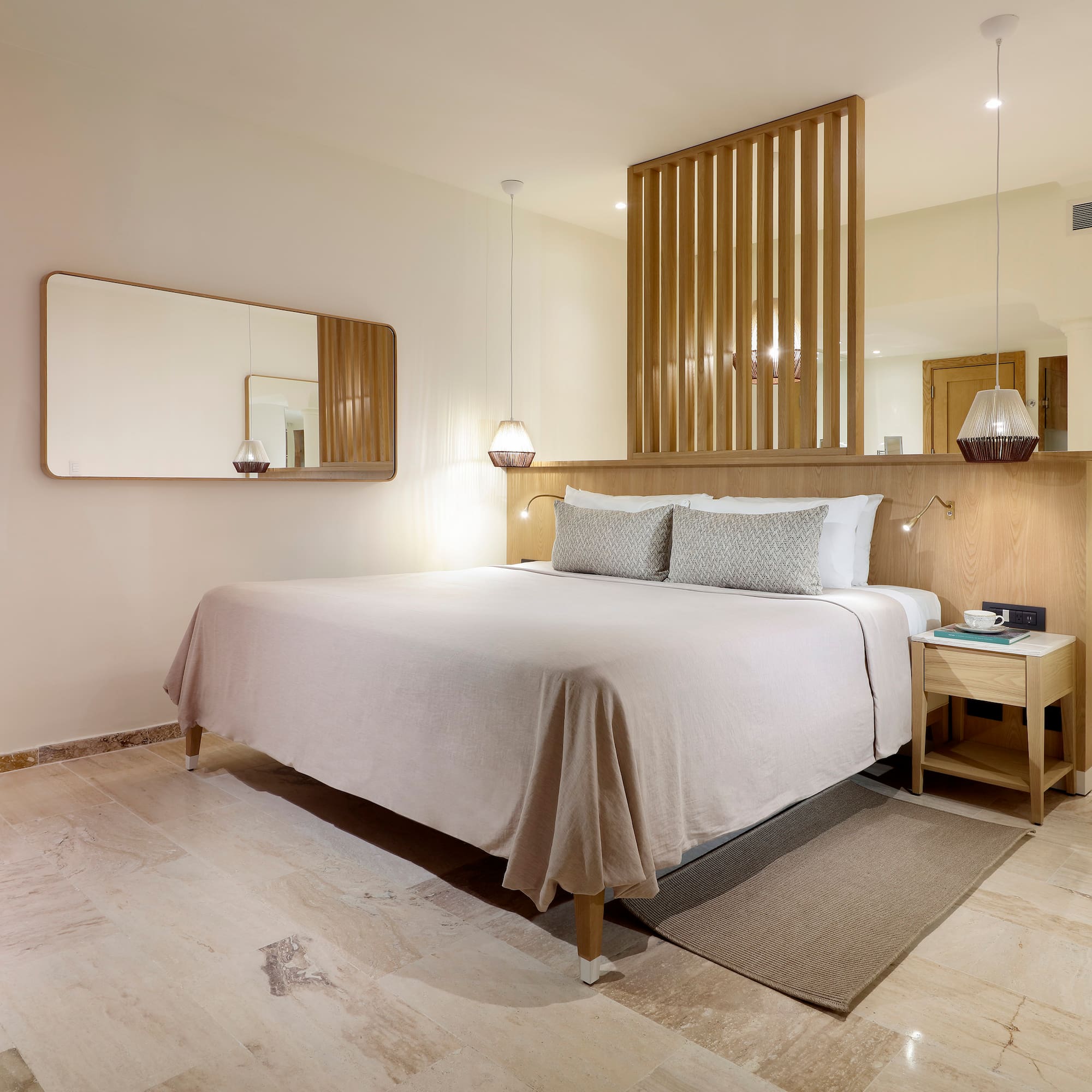 a bed with a mirror above it