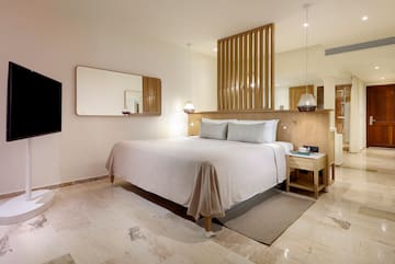 a bed with a mirror above it