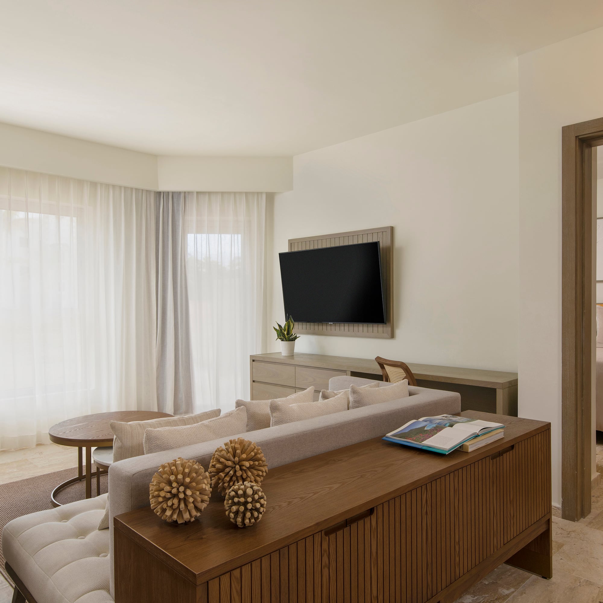 a living room with a tv and couch