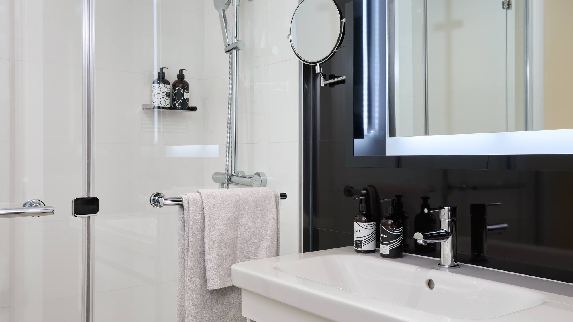 a bathroom with a mirror and a sink