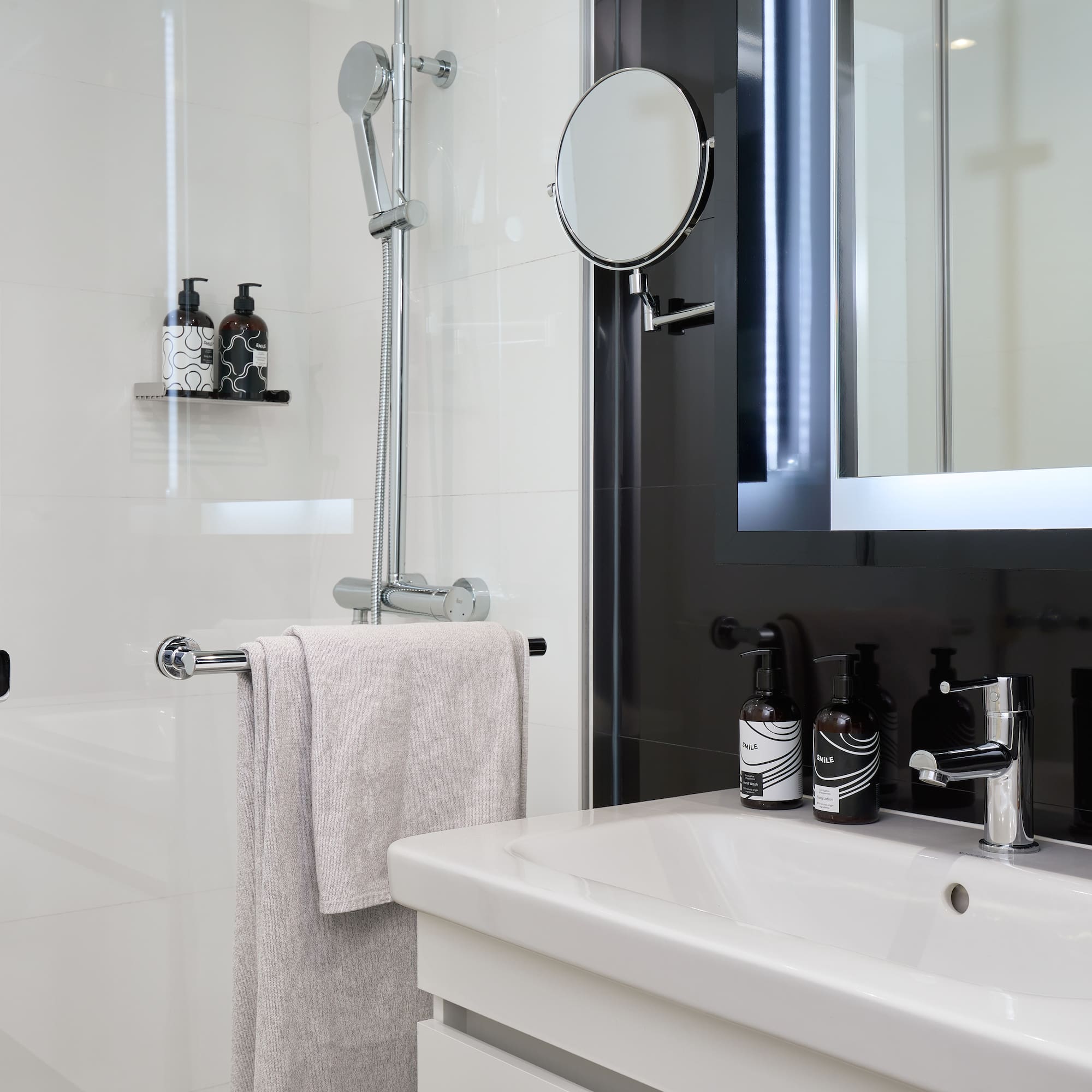 a bathroom with a mirror and a sink