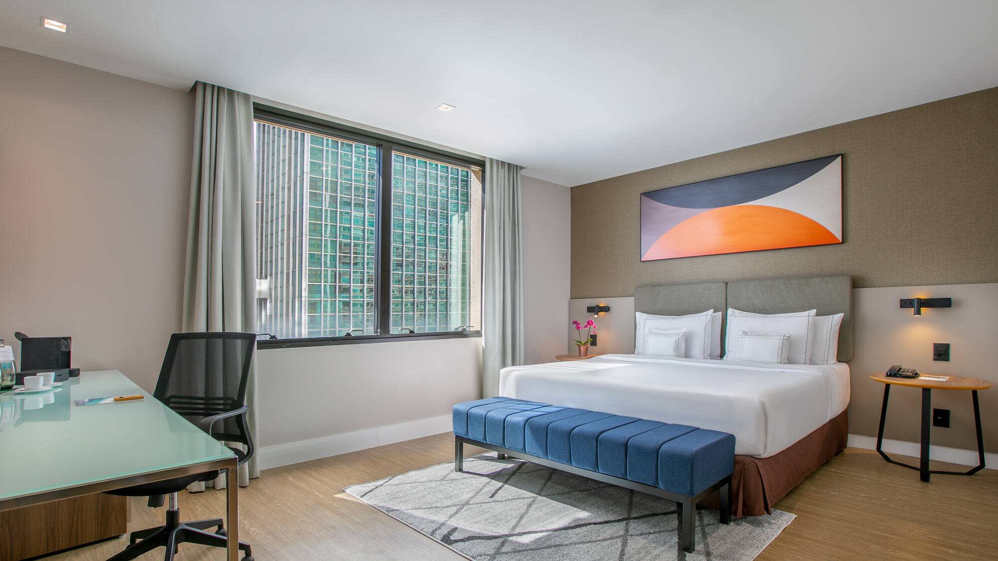 a room with a bed and a desk