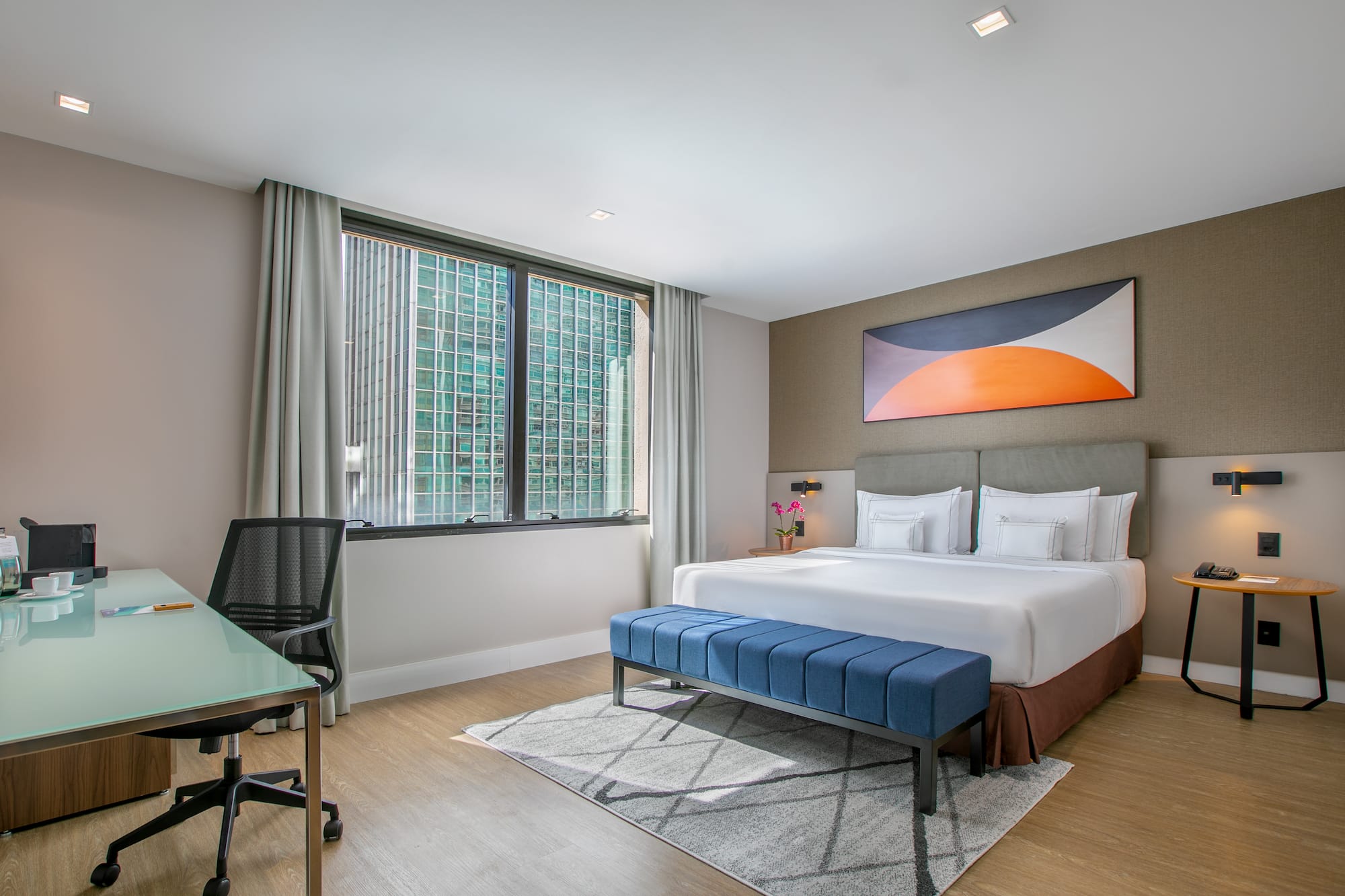 a room with a bed and a desk