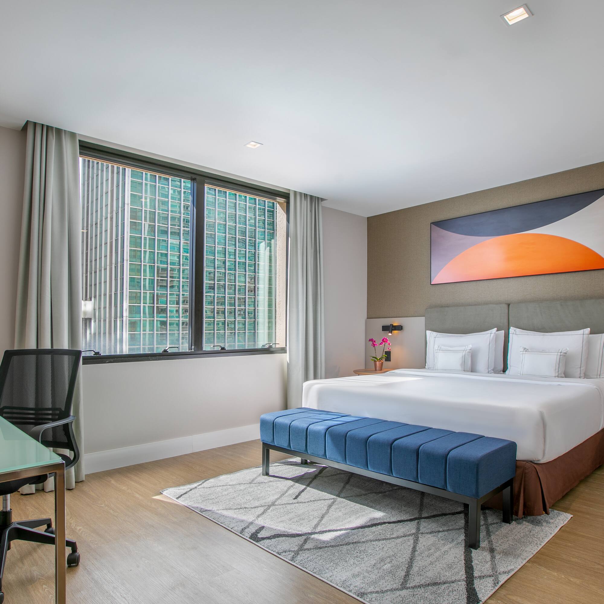 a room with a bed and a desk