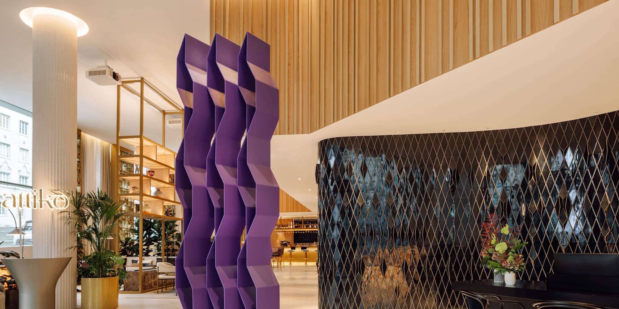 a purple sculpture in a lobby