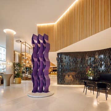 a purple sculpture in a lobby