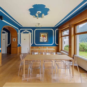 a room with a table and chairs