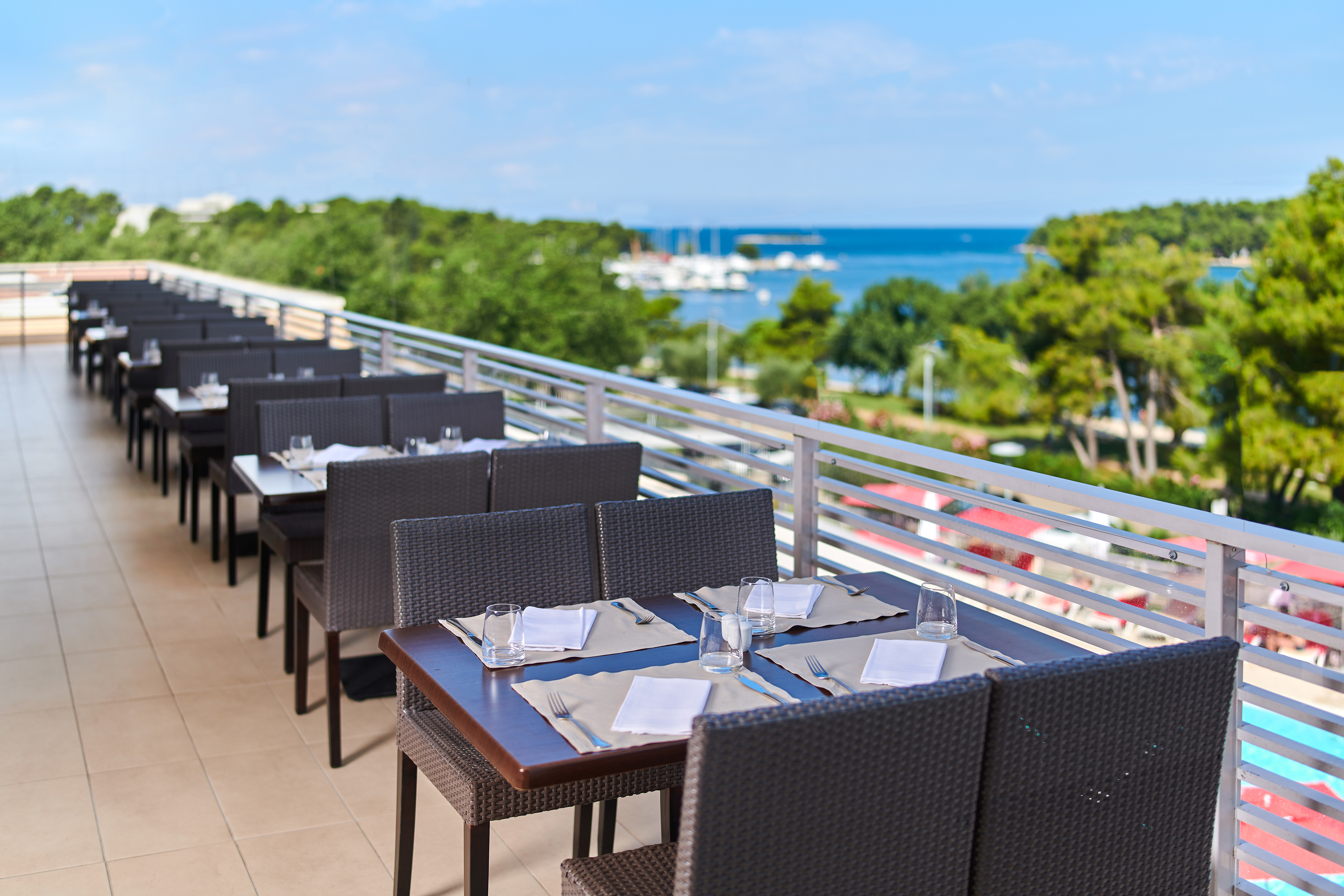 a table and chairs on a patio - Hotel Molindrio Plava Laguna Affiliated by Meliá, Poreč
