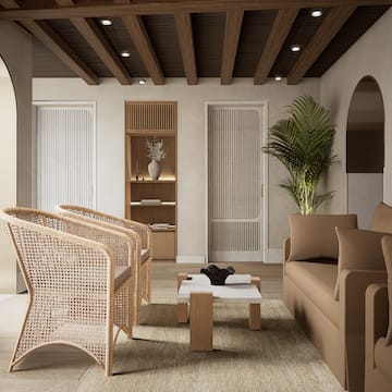 a room with a couch and chairs