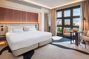 a bedroom with a bed and a table