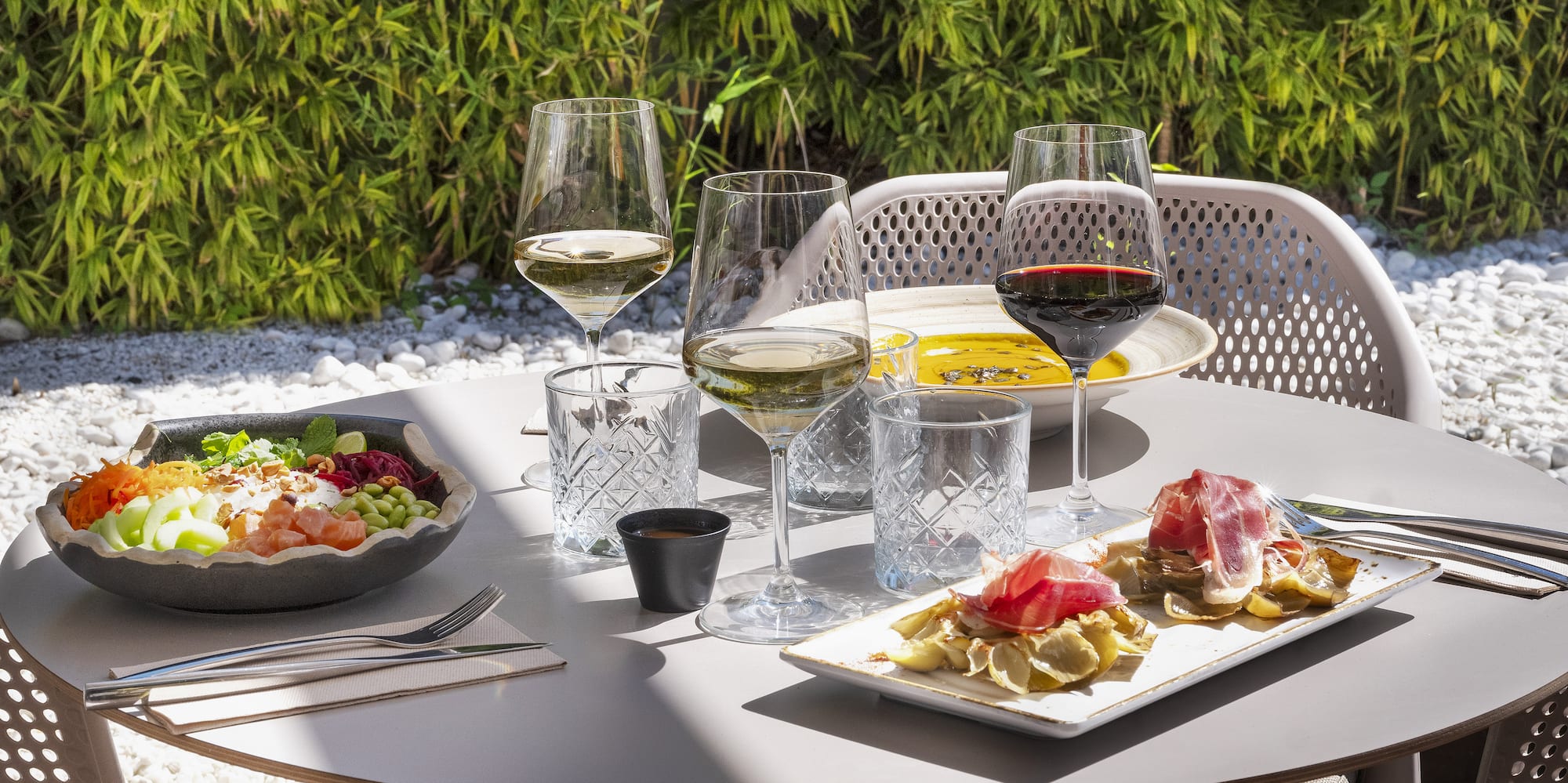 a table with food and wine glasses on it