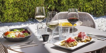 a table with food and wine glasses on it