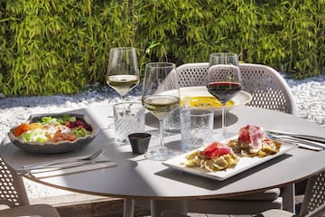 a table with food and wine glasses on it