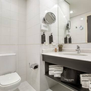 a bathroom with a sink and mirror