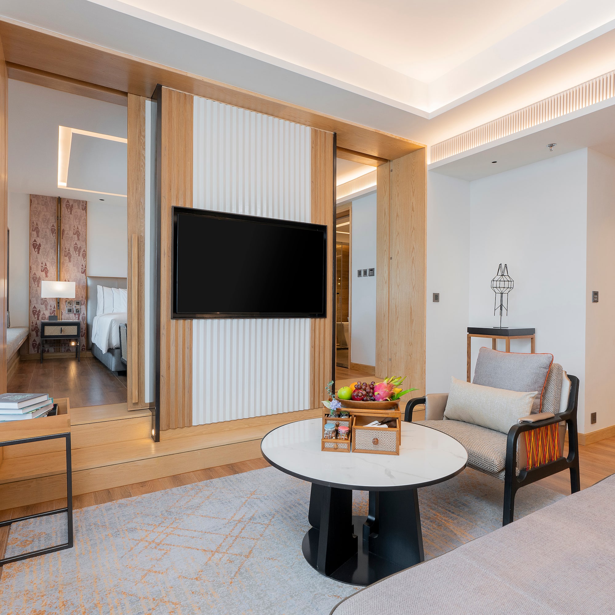 a room with a television and a bed