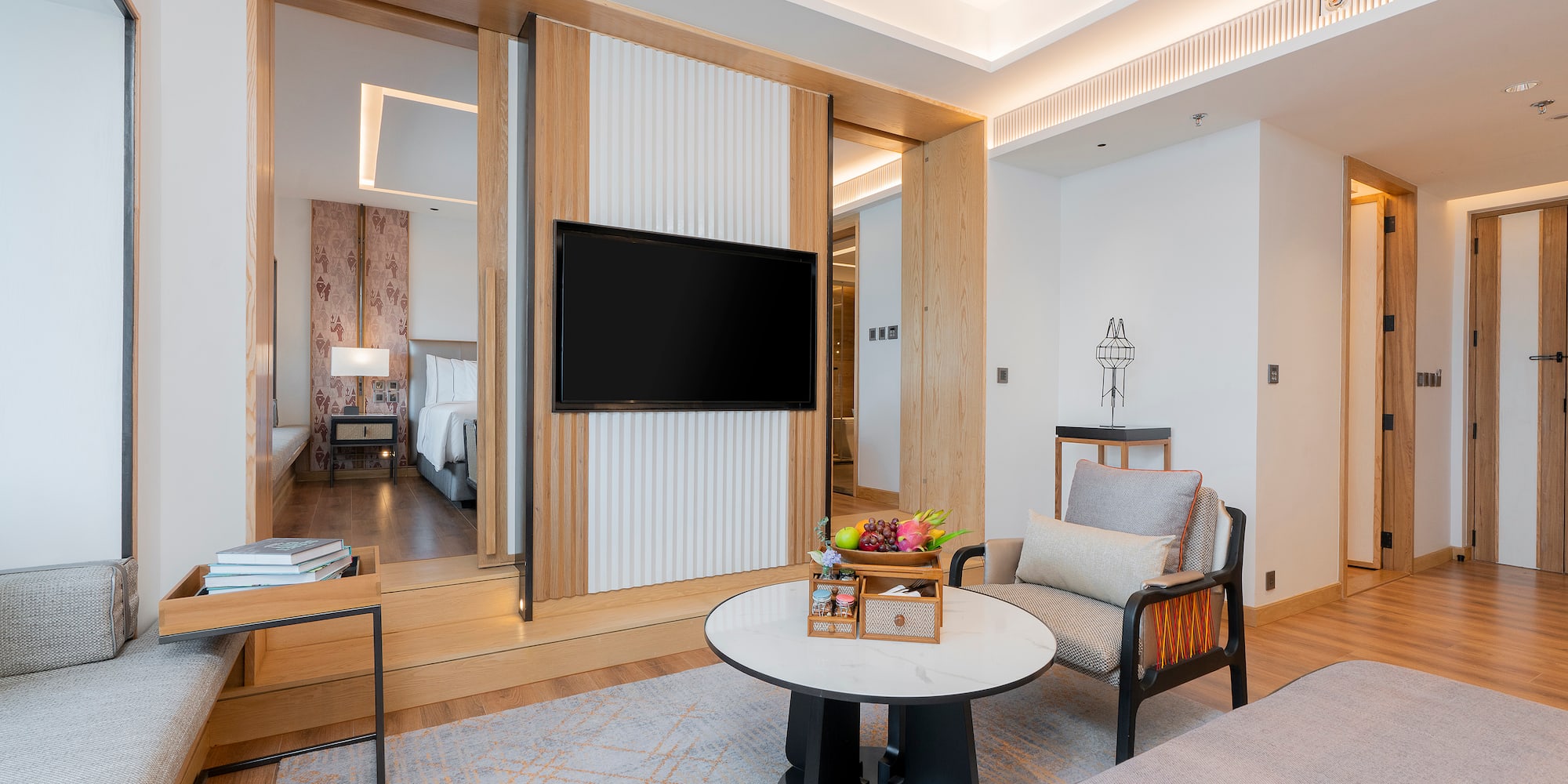 a room with a television and a bed