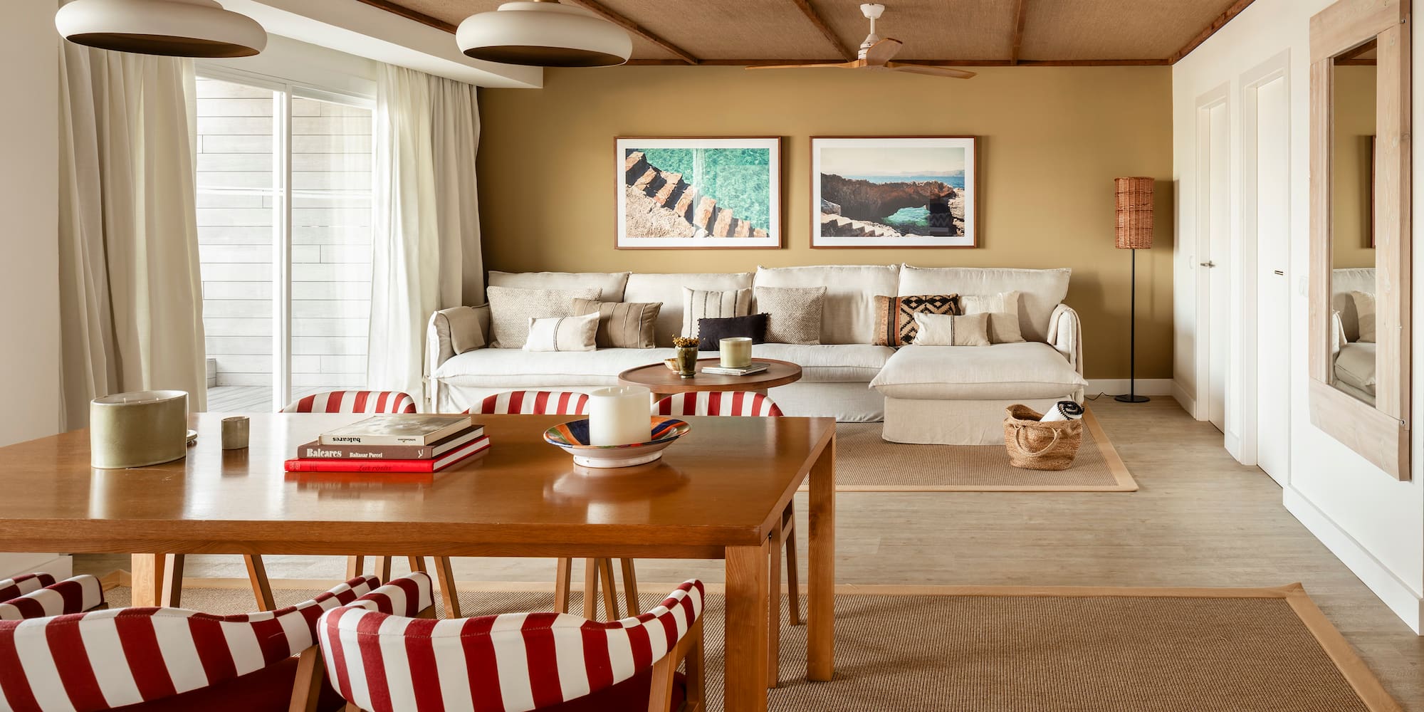 a living room with a table and chairs