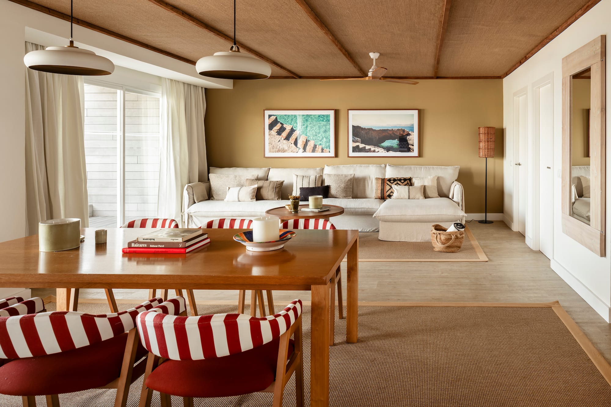 a living room with a table and chairs