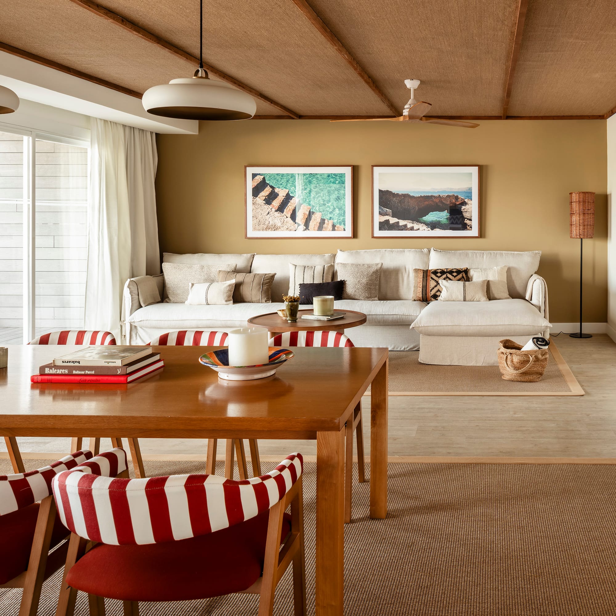 a living room with a table and chairs