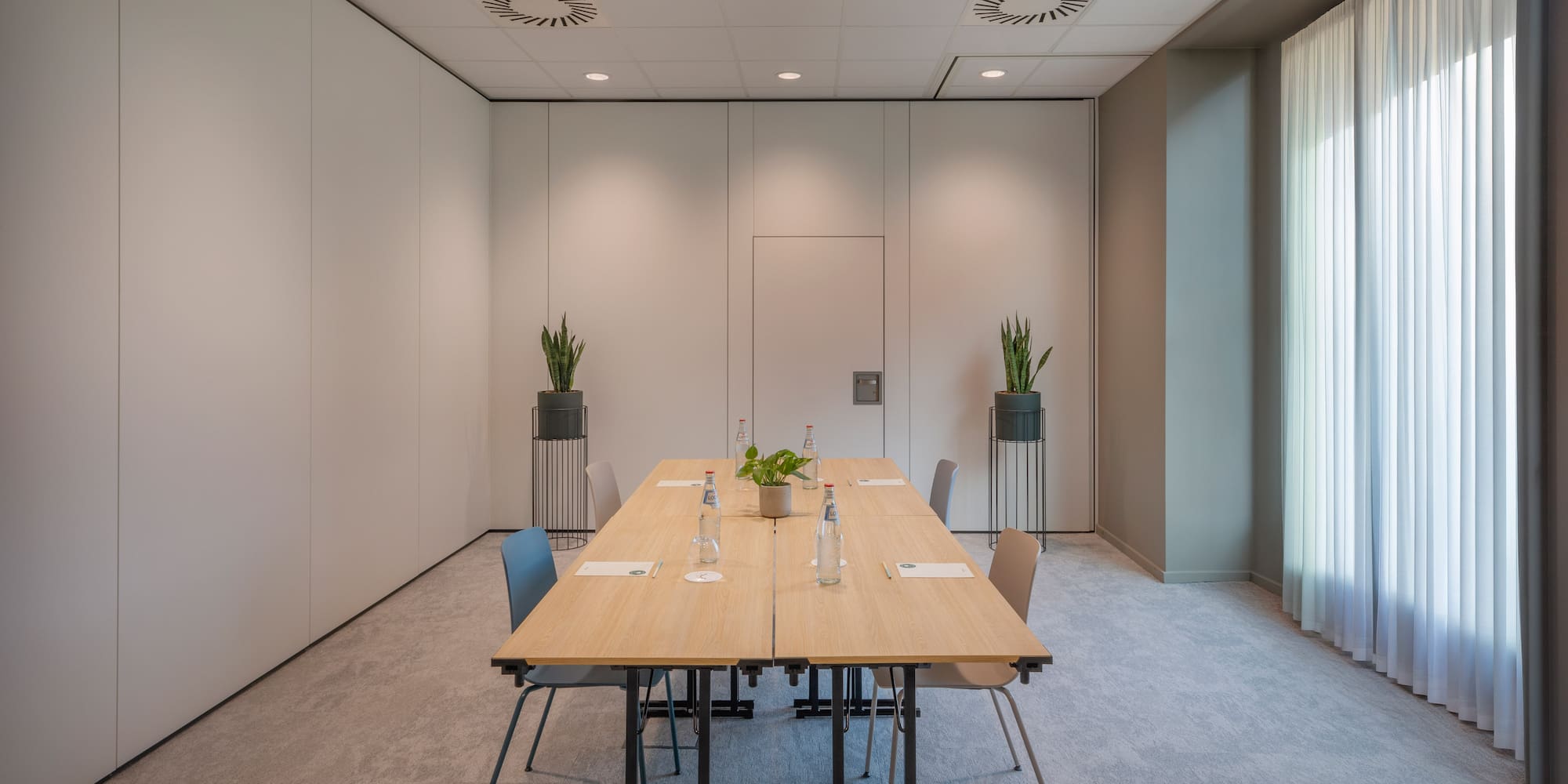 a room with a table and chairs