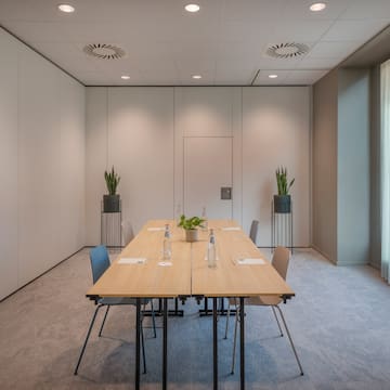 a room with a table and chairs