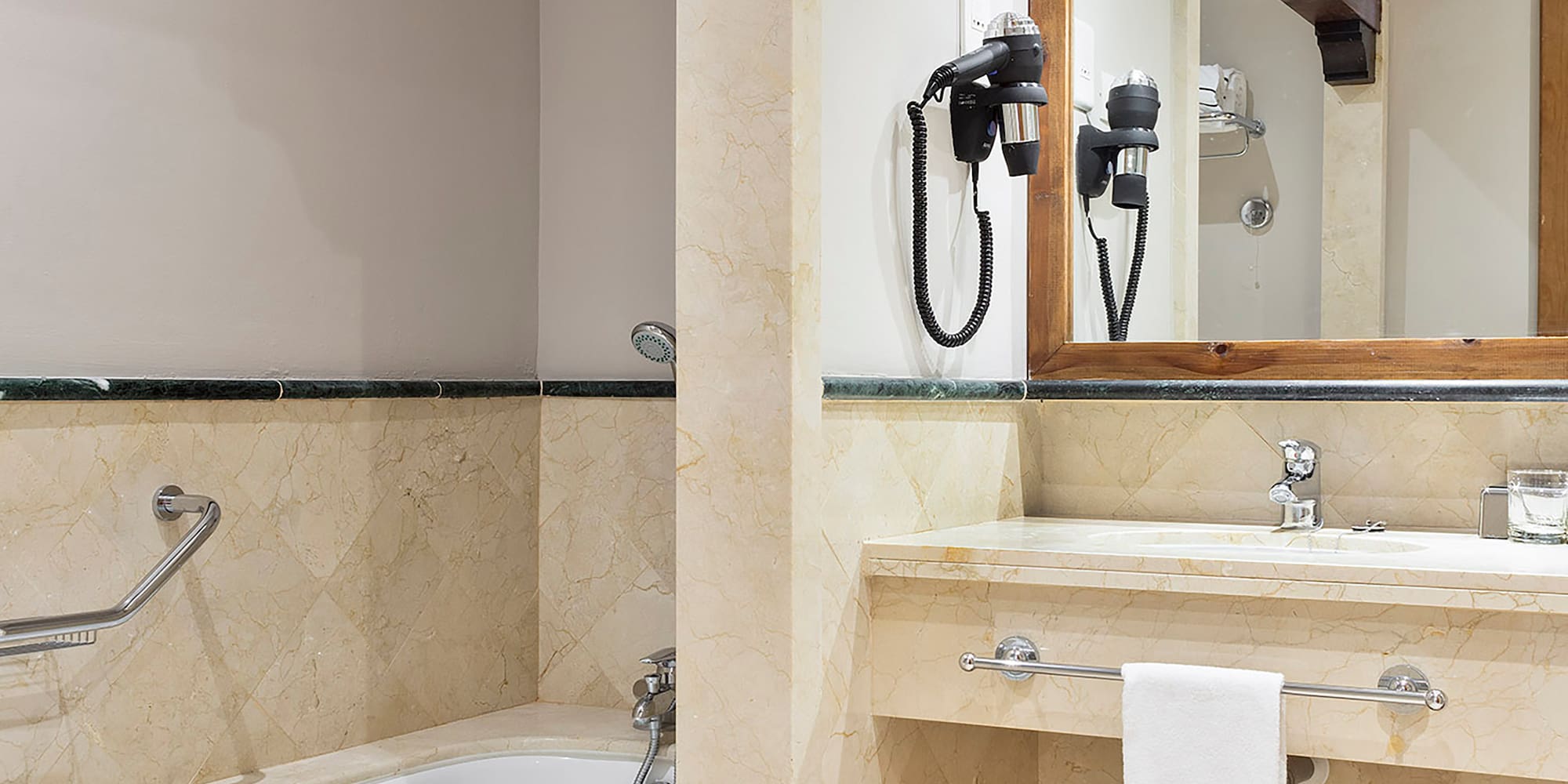 a bathroom with a bathtub and sink