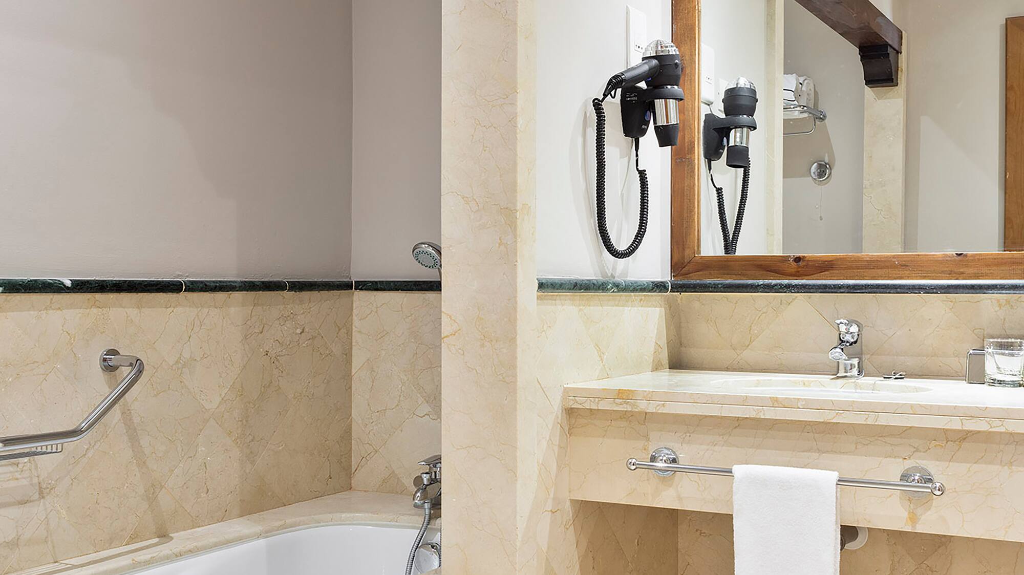 a bathroom with a bathtub and sink