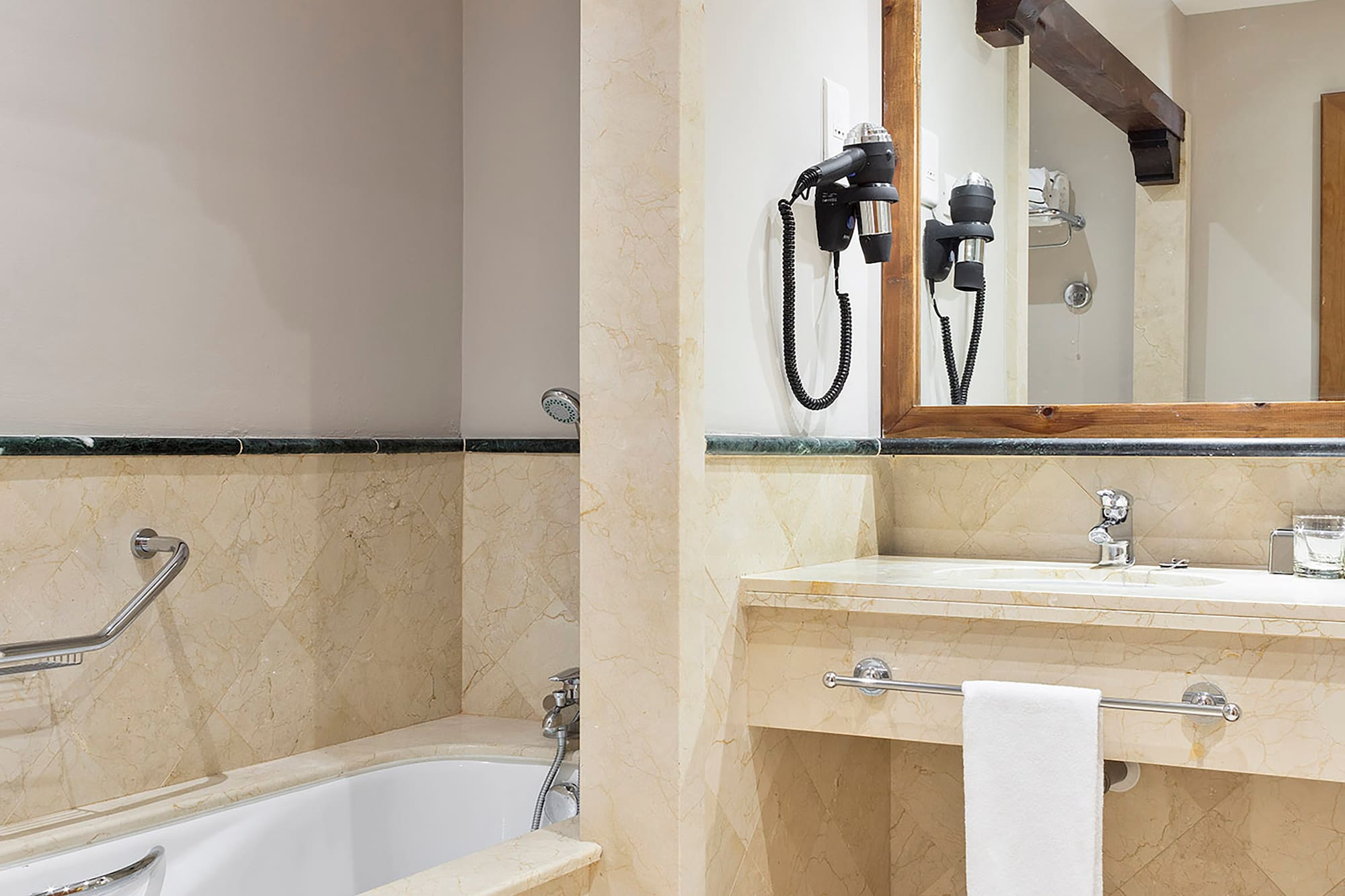 a bathroom with a bathtub and sink