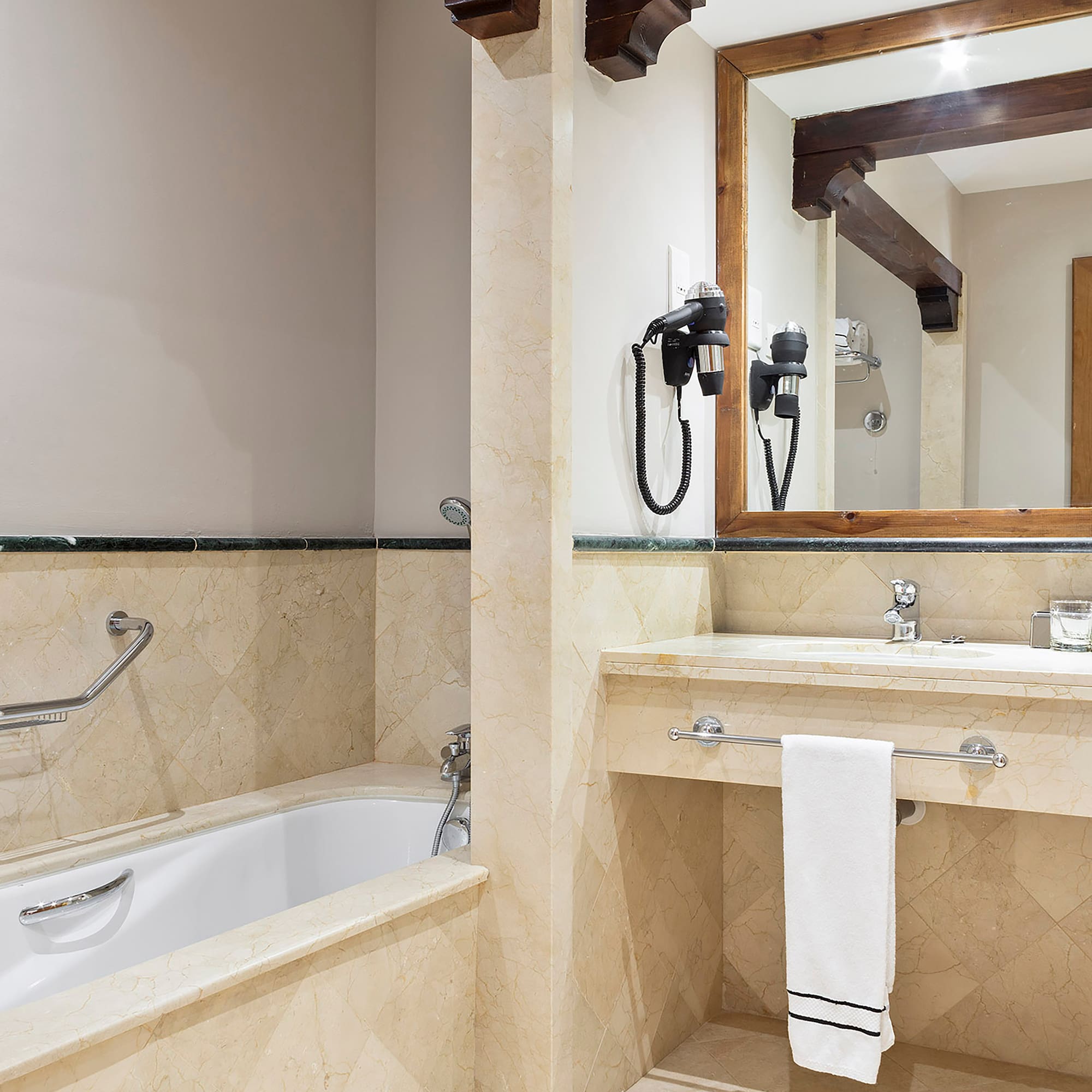 a bathroom with a bathtub and sink