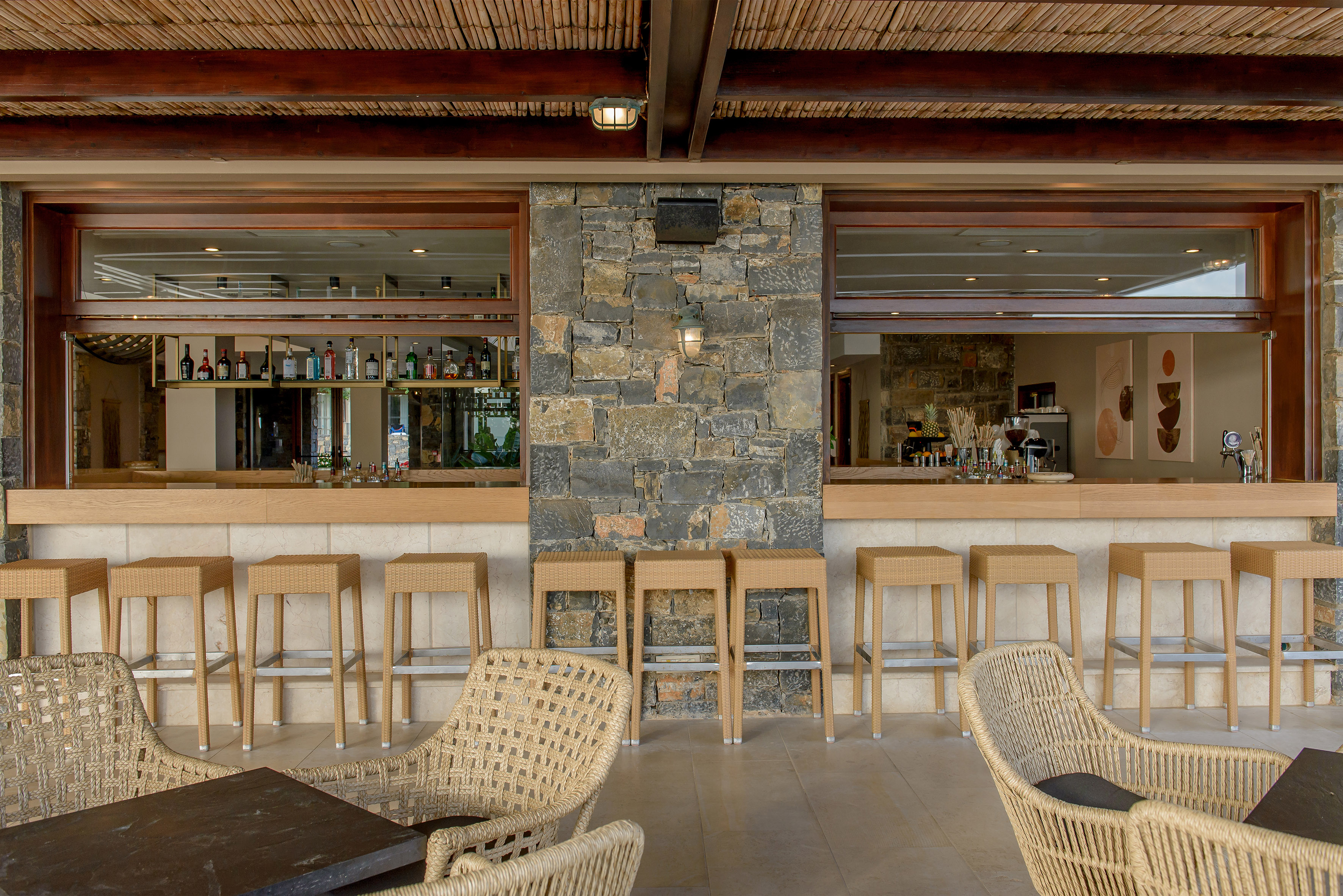 a bar with chairs and tables