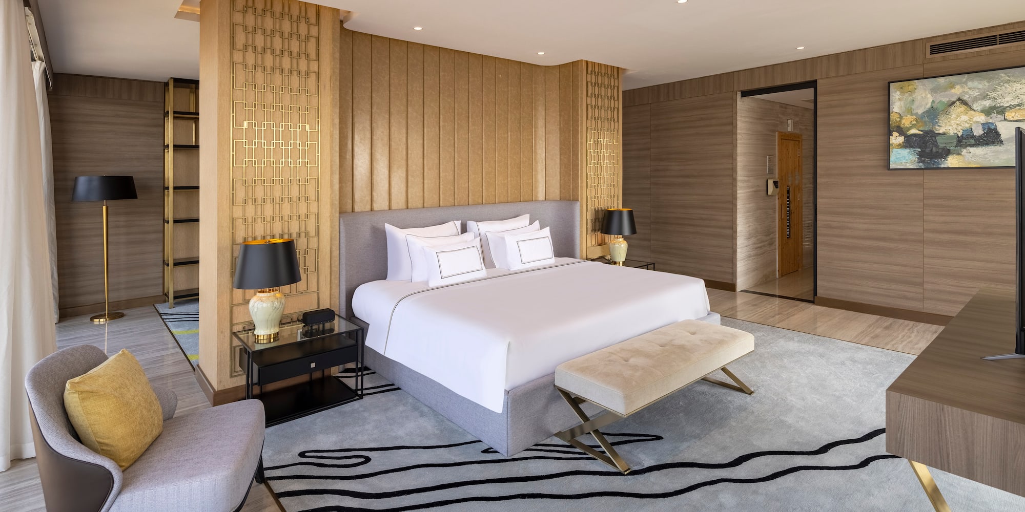 a bedroom with a bed and a rug