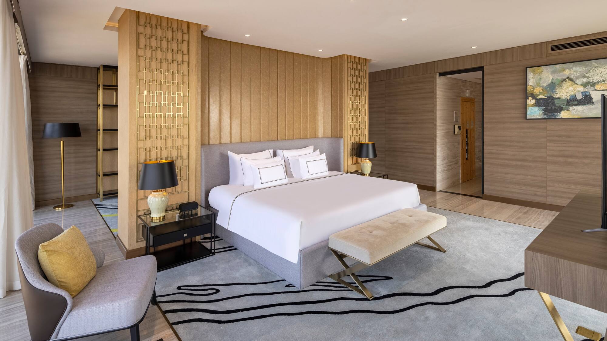 a bedroom with a bed and a rug