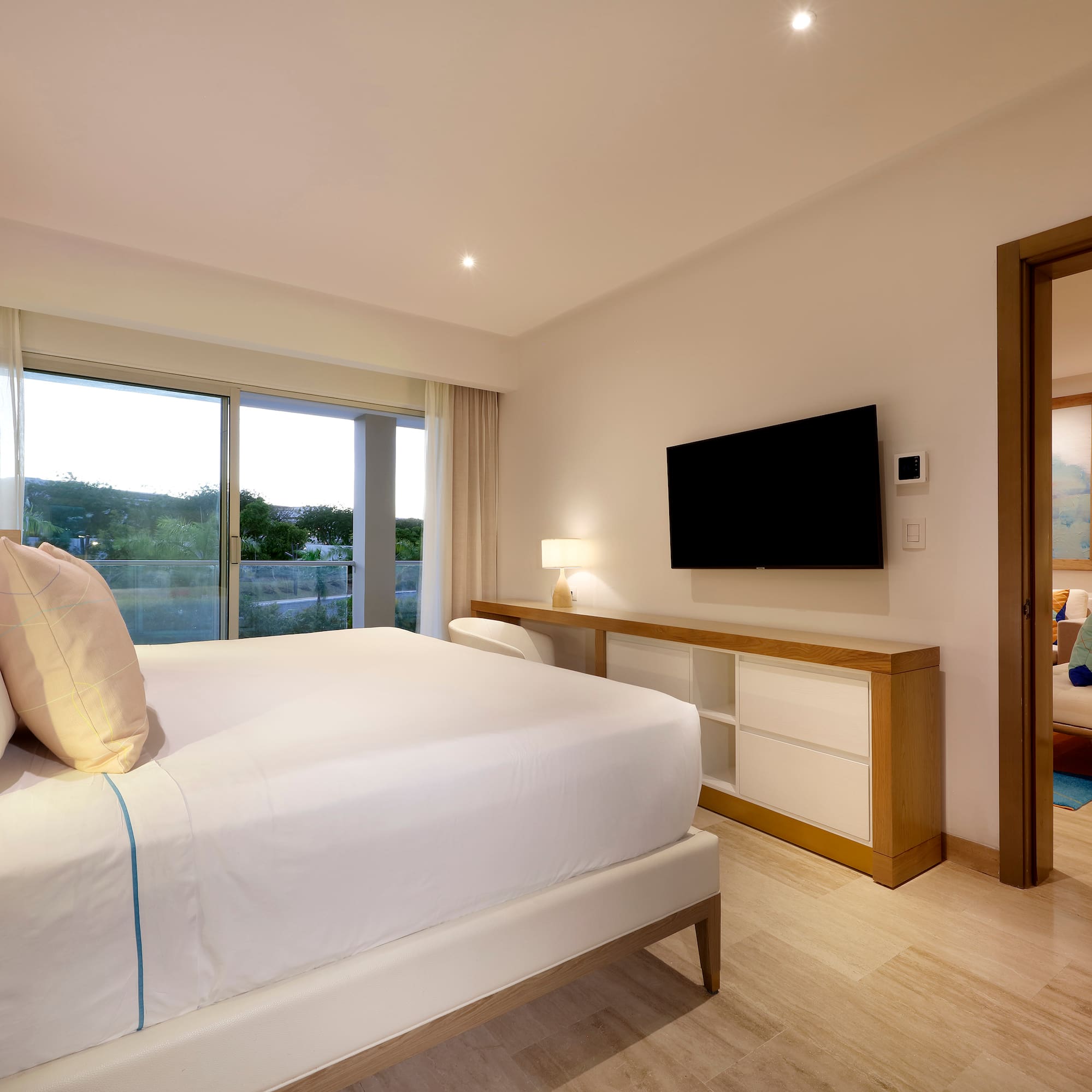 a bedroom with a television and a bed