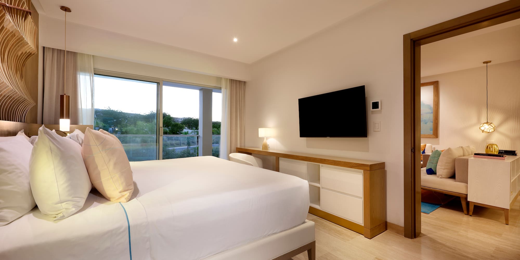 a bedroom with a television and a bed