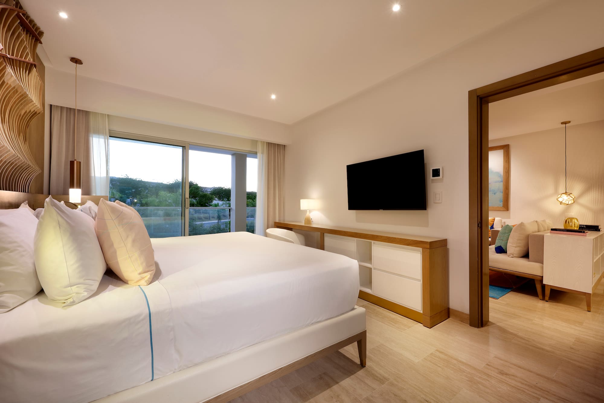 a bedroom with a television and a bed