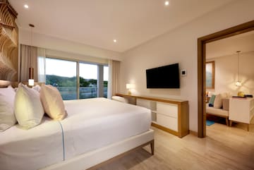 a bedroom with a television and a bed