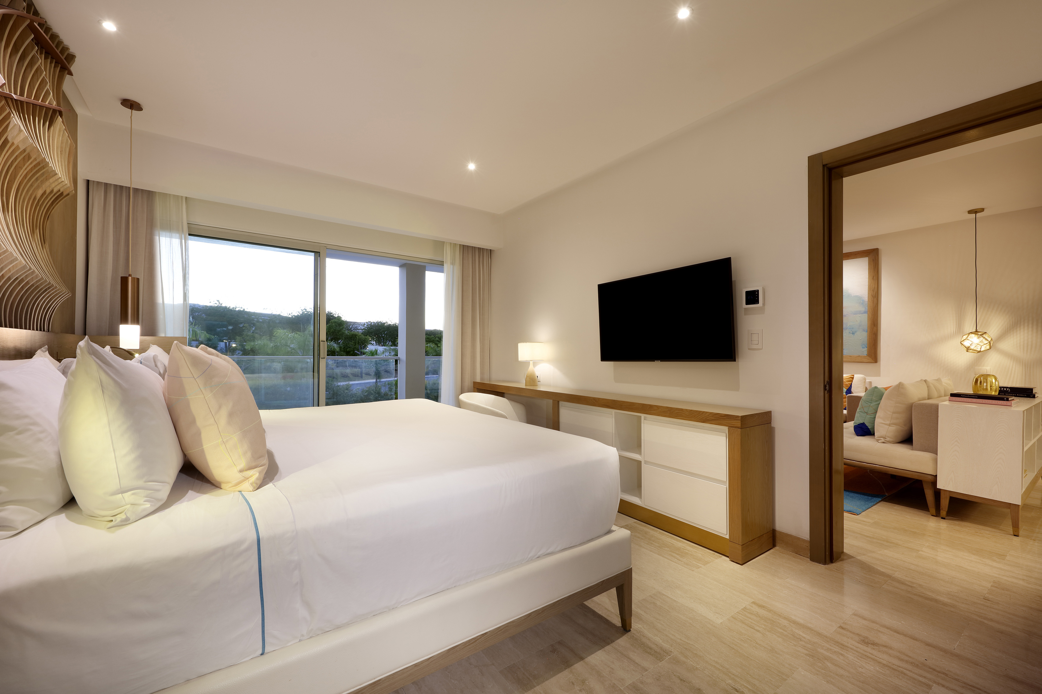 a bedroom with a television and a bed