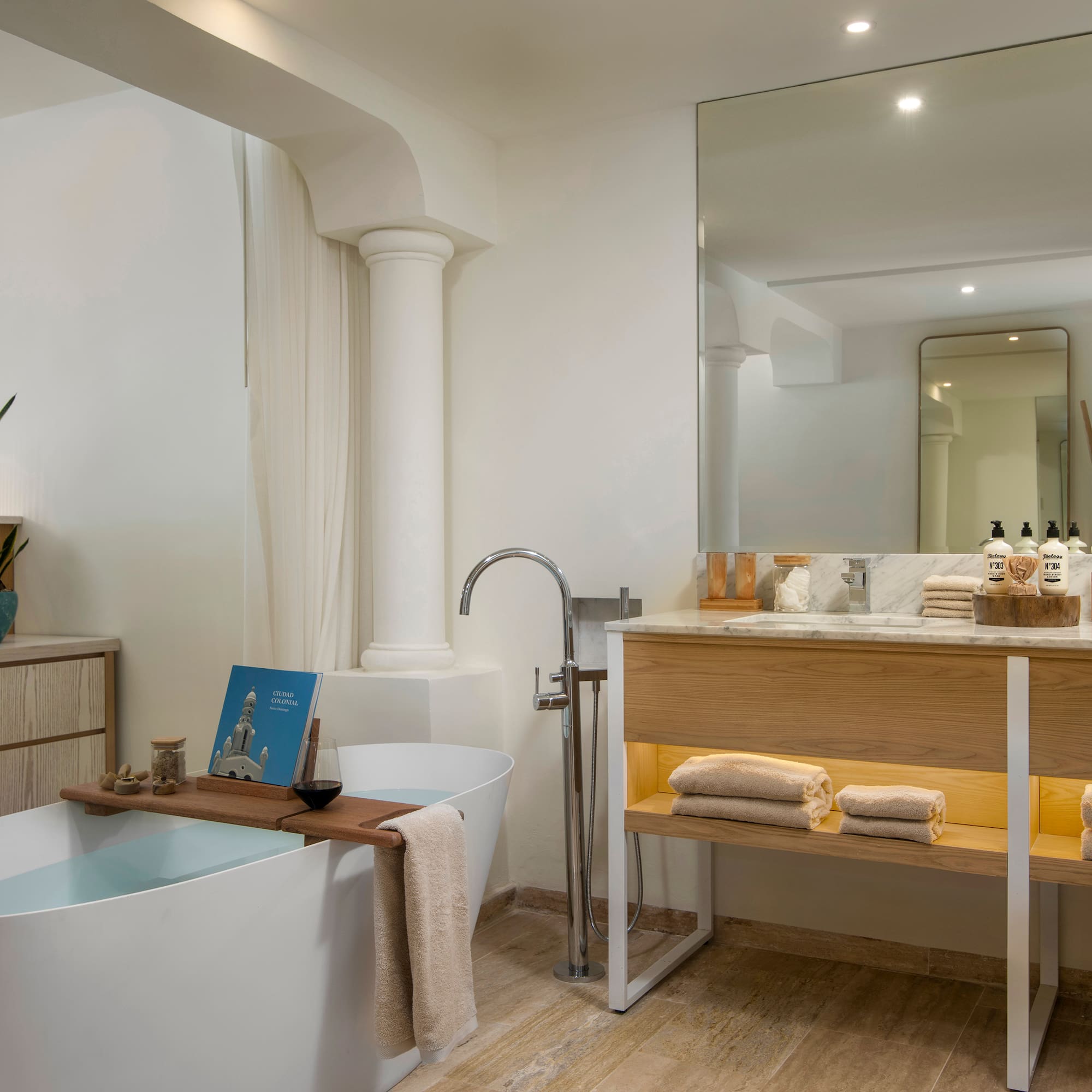 a bathroom with a tub and a sink