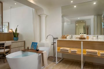 a bathroom with a tub and a sink