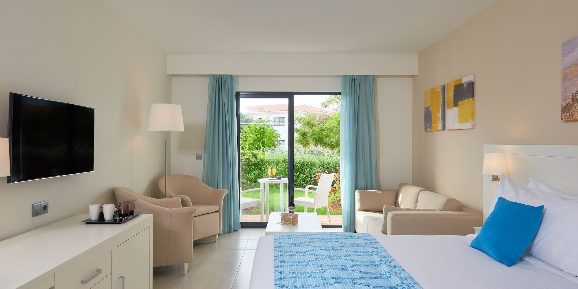 a room with a bed and a couch and a table