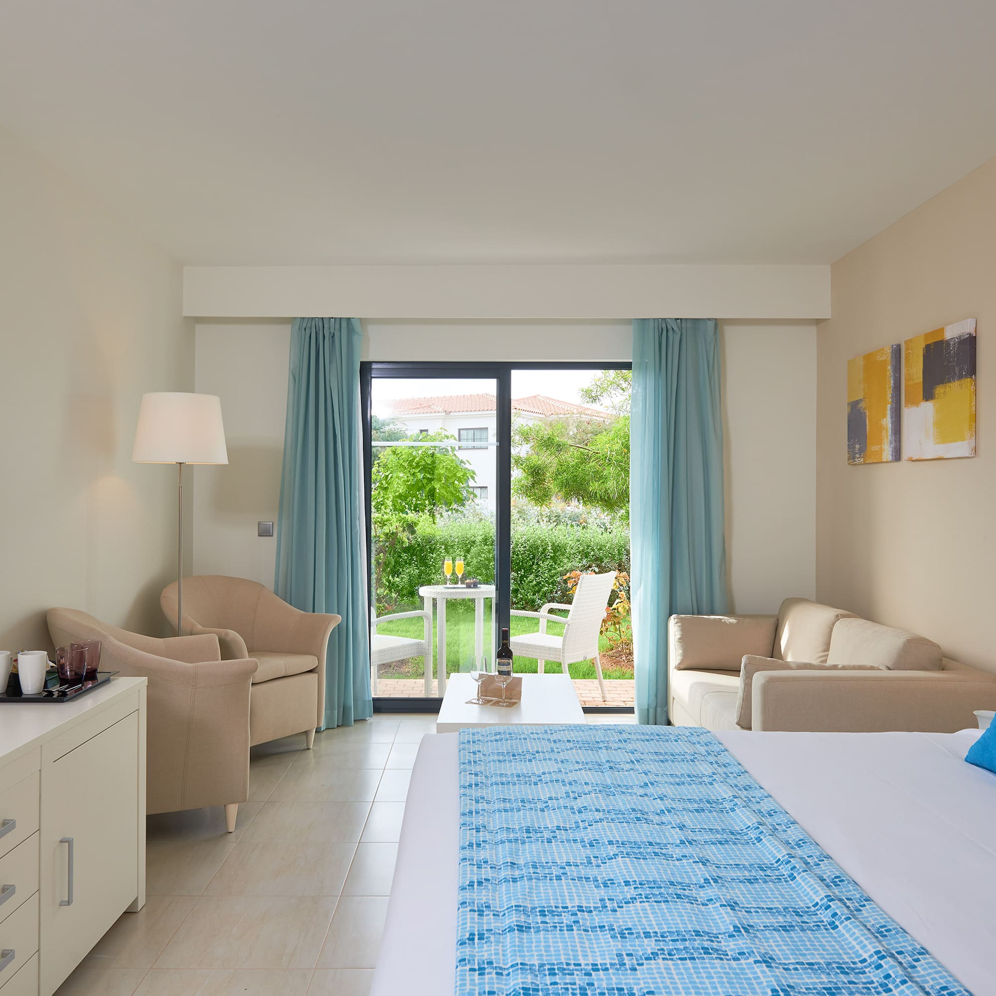 a room with a bed and a couch and a table