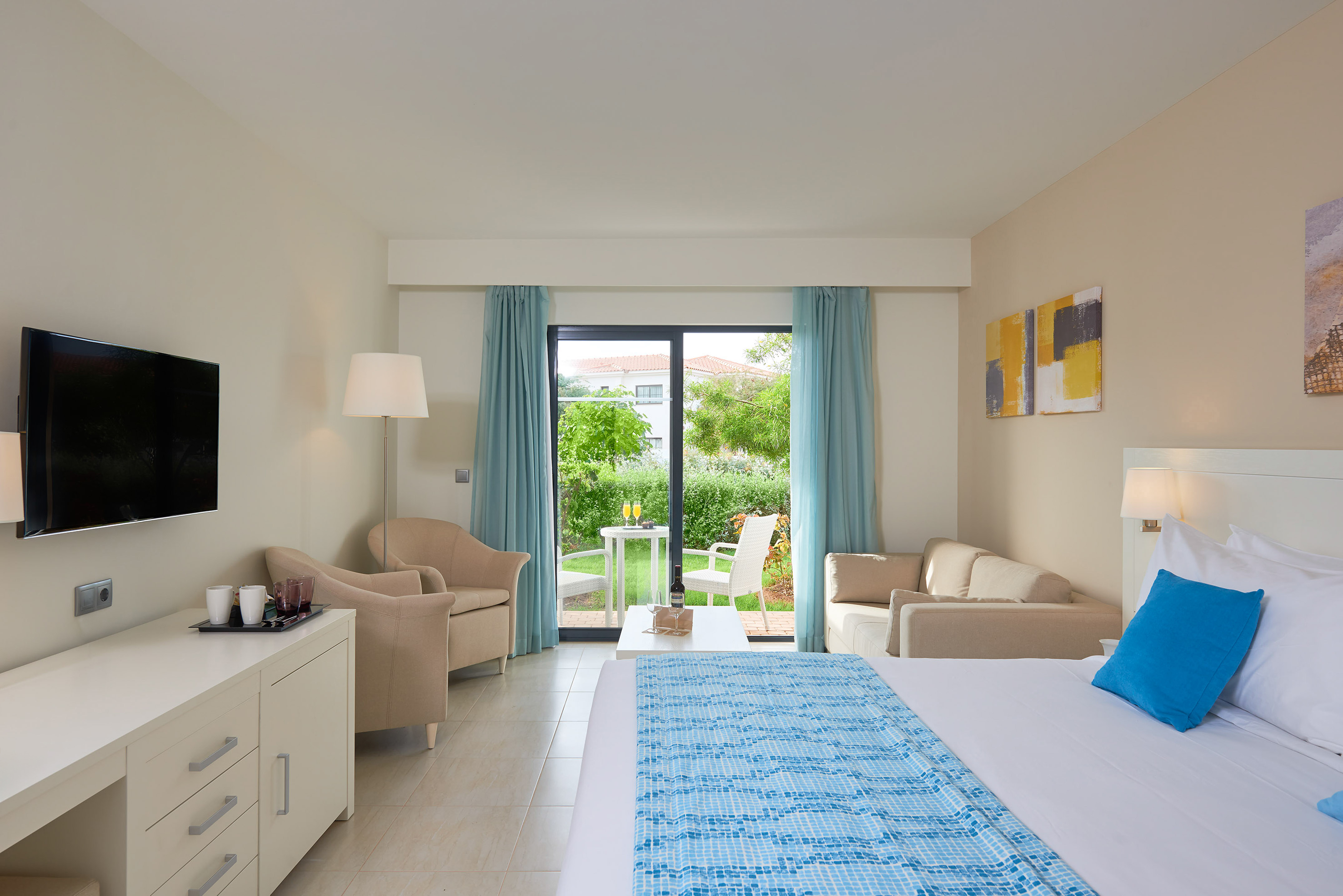 a room with a bed and a couch and a table