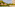 Luxury tropical resort pool, two palapa cabanas, and hotel building.