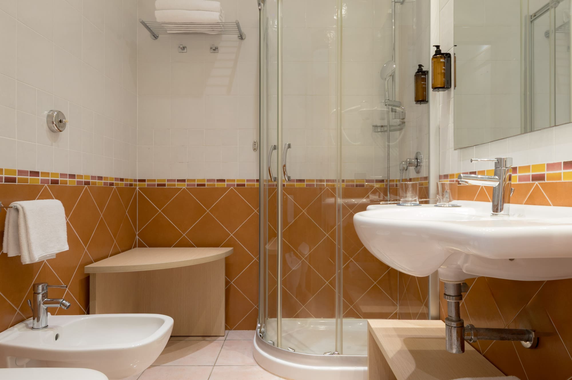 a bathroom with a shower and sink