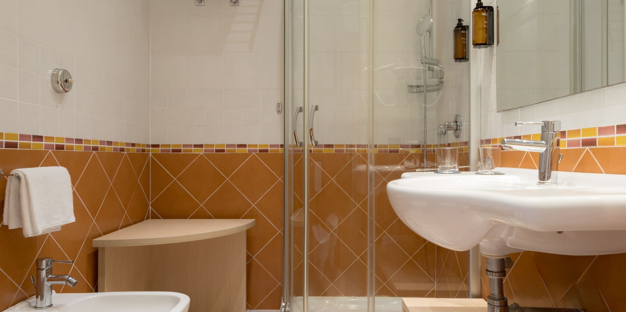 a bathroom with a shower and sink