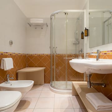 a bathroom with a shower and sink