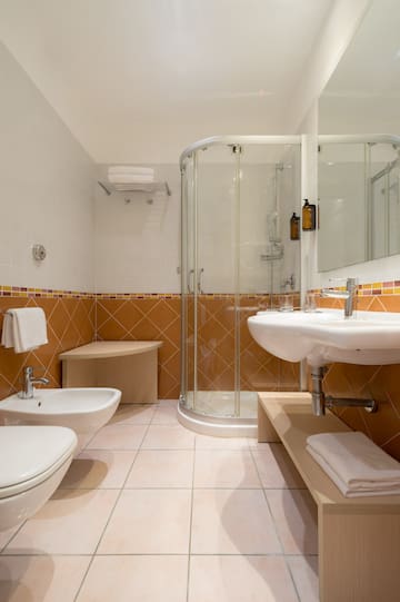 a bathroom with a shower and sink