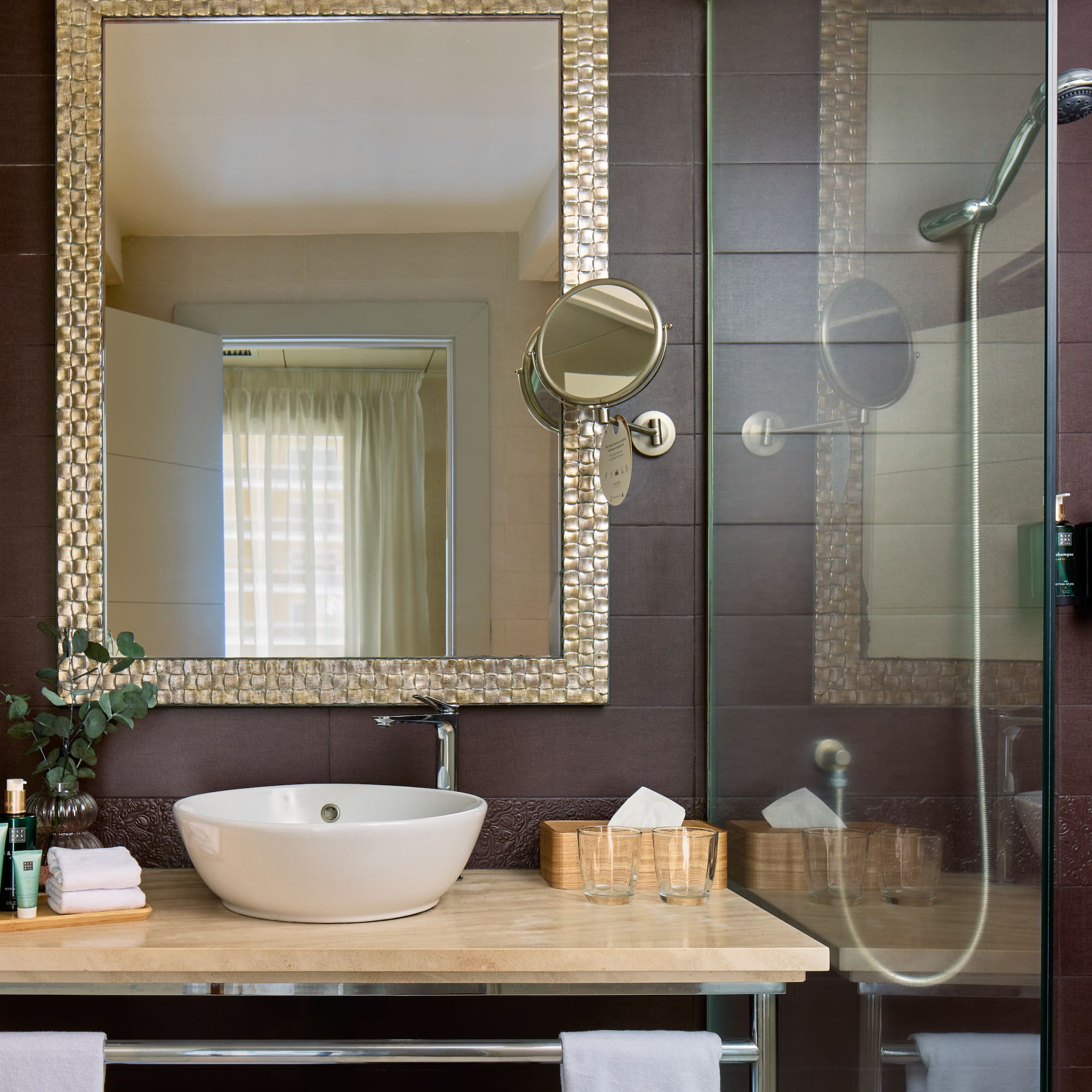 a bathroom with a mirror and sink